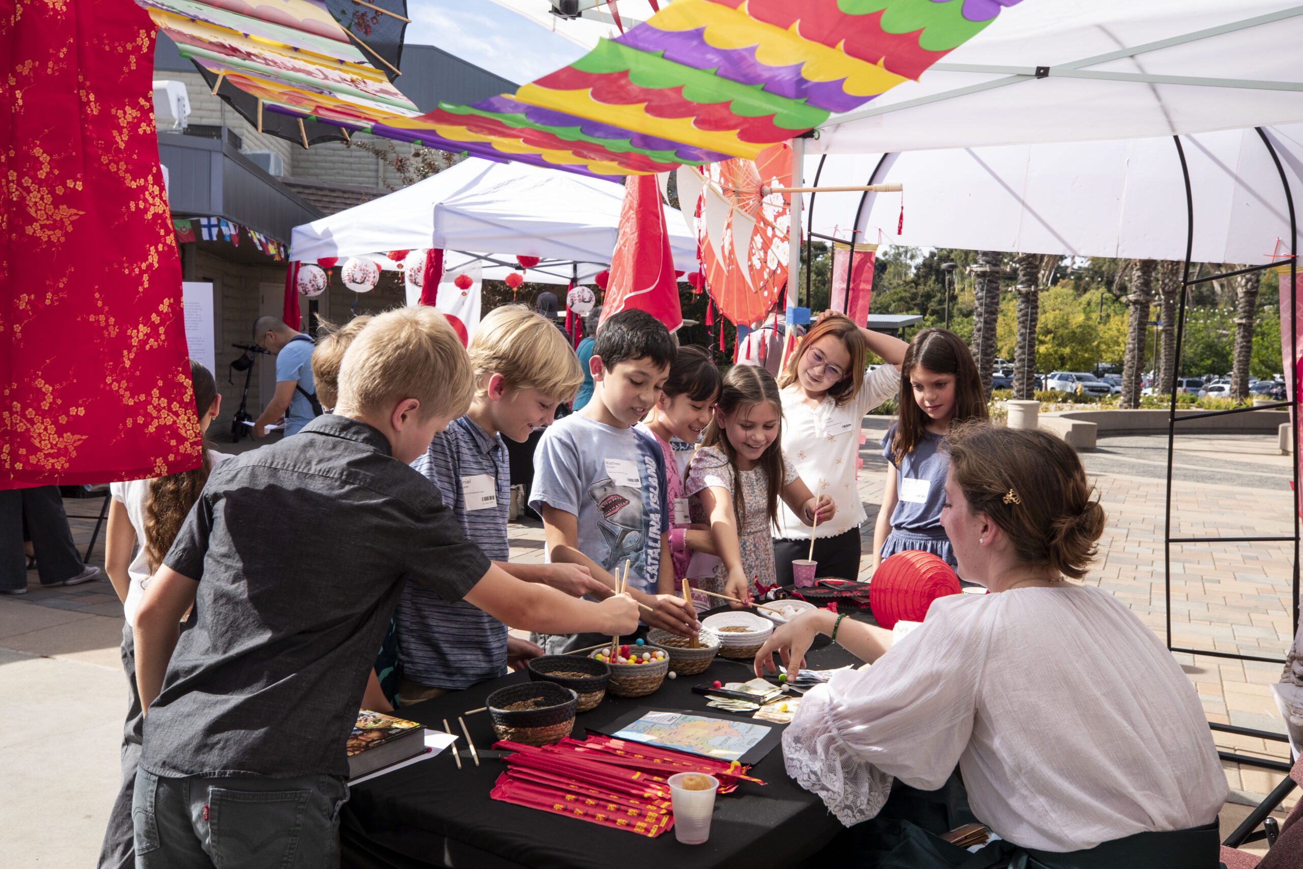 People Around Info Booth | Global Sunday | Emmanuel Faith Community Church